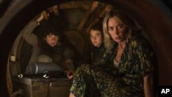 This image released by Paramount Pictures shows, from left, Noah Jupe, Millicent Simmonds and Emily Blunt in a scene from "A Quiet Place Part II." 