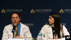 FILE - Dr. Dorry Segev, left and Dr. Christine Durand answer questions about the first ever HIV-positive liver transplant in the world during a news conference at Johns Hopkins hospital, March 30, 2016 in Baltimore.