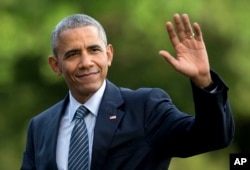 FILE - President Barack Obama walks across the South Lawn of the White House, in Washington, July 5, 2016.