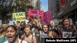 FILE - In this Friday Sept. 20, 2019 file photo, climate change activists participate in an environmental demonstration as part of a global youth-led day of action in New York, as a wave of climate change protests swept across the globe.