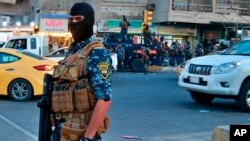 Iraqi Federal police are deployed in Sadr City, Baghdad, Iraq, Oct. 7, 2019. 