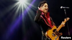 U.S. musician Prince performs on stage at Yas Arena in Yas Island, Abu Dhabi, UAE, Nov. 14, 2010. 