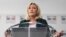 FILE - President of the French far-right party Rassemblement National (National Rally) and MP Marine Le Pen gives a press conference, in Paris, March 9, 2021. 