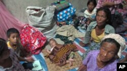 IDPs from different villages have become new neighbors in their camp, Laiza, Burma, August 2011.