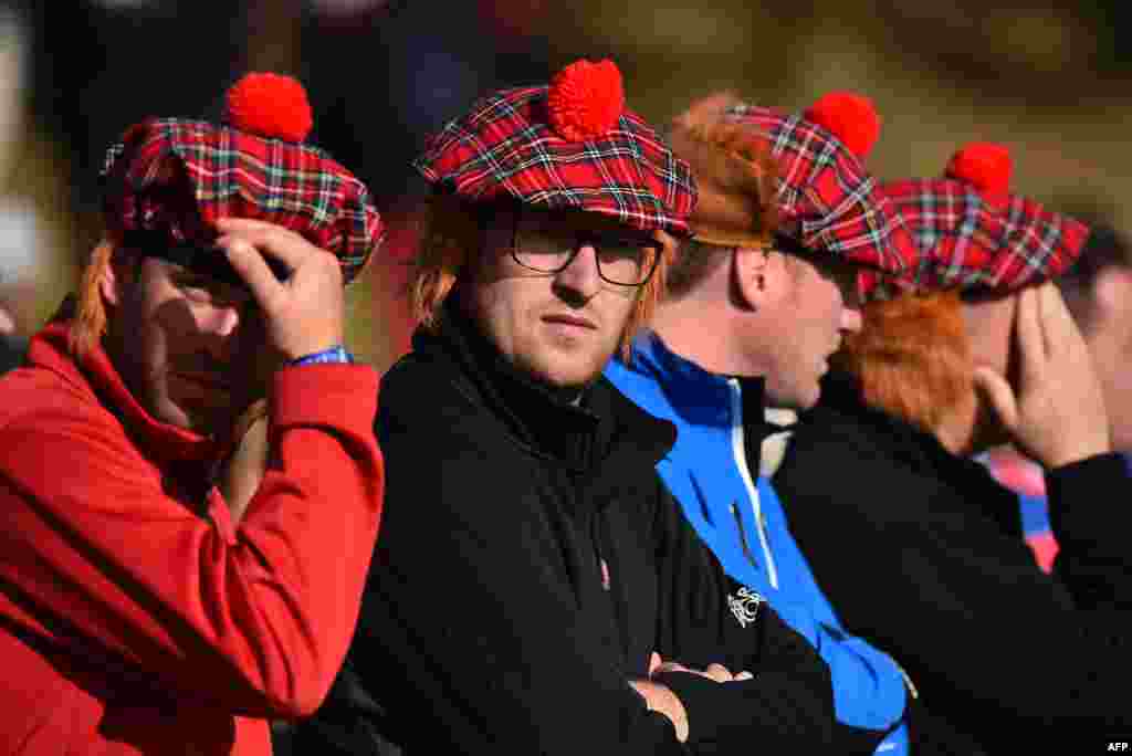 Spectators wearing Scottish caps watch play in the fourball golf matches at Gleneagles in Gleneagles, Scotland during the 2014 Ryder Cup competition between Europe and the U.S.