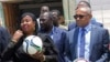 FILE - Confederation of African Football President Ahmad Ahmad (R) and Somali Sports Minister Khadija Mohamed Dirie (L) pose for a photo during a tour to a soccer stadium in Mogadishu, Somalia, April 17, 2017. 