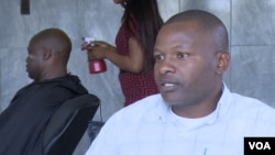 Collins Chigwagwa who runs a small barbershop in a Harare suburb, last week bought a solar power system that he says can power his shop for up to eight hours to reduce the impact of Zimbabwe’s lengthy power cuts (C. Mavhunga/VOA)