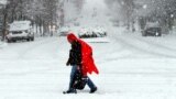 A man walks through heavy snow in downtown Nashville, Tennessee. Much of downtown was deserted as state and city government offices were closed for the day.&nbsp; A major winter storm is hitting much of the Eastern part of the U.S. and also affecting the Midwest and South.&nbsp; &nbsp;