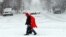 A man walks through heavy snow in downtown Nashville, Tennessee. Much of downtown was deserted as state and city government offices were closed for the day.&nbsp; A major winter storm is hitting much of the Eastern part of the U.S. and also affecting the Midwest and South.&nbsp; &nbsp;