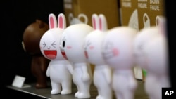 FILE - Figures of Cony the bunny, one of Line's characters, are displayed at the Line Friends flagship shop in Seoul, South Korea.