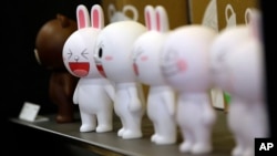 FILE - Figures of Cony the bunny, one of Line's characters, are displayed at the Line Friends flagship shop in Seoul, South Korea.