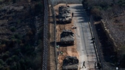 Israeli soldiers gather near the ceasefire line between Syria and the Israeli-occupied Golan Heights, December 9, 2024. REUTERS/Ammar Awad