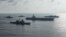 The Ronald Reagan Strike Group ships conduct a photo exercise with the Japan Maritime Self-Defense Force ships in the South China Sea, Aug. 31, 2018.