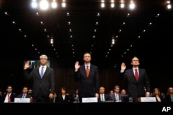 From left, Facebook's General Counsel Colin Stretch, Twitter's Acting General Counsel Sean Edgett, and Google's Senior Vice President and General Counsel Kent Walker, are sworn in for a Senate Intelligence Committee hearing on Russian election activity and technology, Nov. 1, 2017, on Capitol Hill in Washington.