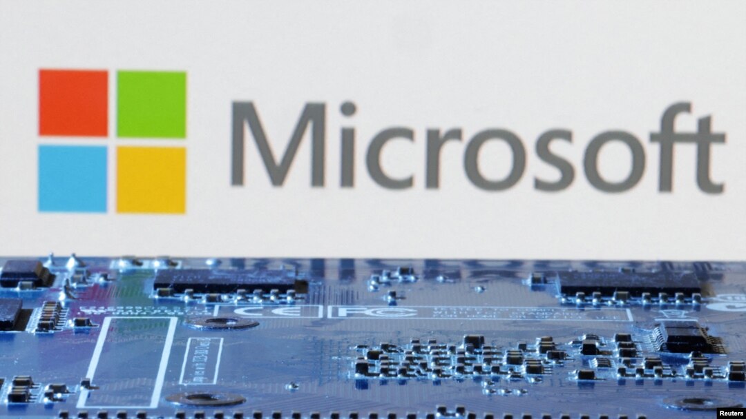 FILE - Microsoft logo is seen near computer motherboard in this illustration taken January 8, 2024. 