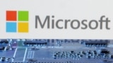 FILE - Microsoft logo is seen near computer motherboard in this illustration taken January 8, 2024. 