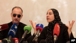 Mother of the Boston bombing suspects, Zubeidat Tsarnaeva, with the suspects' father, Anzor Tsarnaev, addressing news conference in Makhachkala, southern Russian province of Dagestan, April 25, 2013.