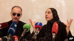 The mother of the two Boston bombing suspects, Zubeidat Tsarnaeva, with the suspects' father Anzor Tsarnaev, left, speaks at a news conference in Makhachkala, the southern Russian province of Dagestan, April 25, 2013. 