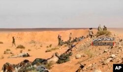 Pro-government troops taking up positions on the Iraq-Syria border in this frame grab from video provided Nov. 8, 2017, by the government-controlled Syrian Central Military Media.