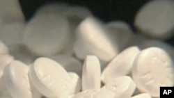 FILE - Aspirin tablets