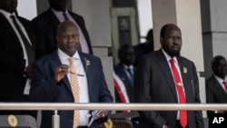 FILE - South Sudanese President Salva Kiir, right, and Vice President Riek Machar, left, attend an event at the John Garang Mausoleum in Juba, South Sudan, on Feb. 5, 2023. Kiir and Machar agreed in June 2024 to postpone general elections until December 2026.