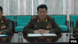 North Korean army officers, from left to right, Col. Kim Meong Hwan, Sr. Col. Pak Gi Yong and Maj. Moon Geong Joon, during a meeting with Thomas Hudner in Pyongyang, July 23, 2013. (Steve Herman/VOA)