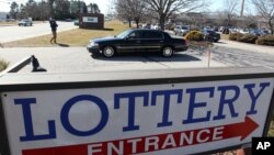A lottery winner leaves the Rhode Island Lottery headquarters in a limousine after being presented a check for $336.4 million 