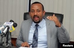 FILE - Abiy Ahmed Ali, now Ethiopia's prime minister, addresses a news conference in Addis Ababa, Ethiopia, Dec. 4, 2015. South Sudan President Salva Kiir is expected to lobby Ahmed Ali for Ethiopia to vote against U.S.-drafted sanctions against Juba on the U.N. Security Council. Ethiopia is currently one of three African non-permanent members of the U.N. body.