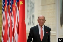 FILE - Commerce Secretary Wilbur Ross arrives at a State Dinner at the Great Hall of the People, Nov. 9, 2017, in Beijing, China.
