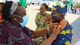 A man receives an AstraZeneca coronavirus vaccine in Abuja, Nigeria, Nov 19, 2021.