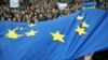 Activists wave European Union flags during a rally in support of Ukraine's integration with the European Union in the center of Lviv, Western Ukraine, Nov. 22, 2013. 