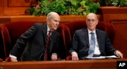 President Russell M. Nelson, left, and his counselor Henry B. Eyring look on during the twice-annual conference of the Church of Jesus Christ of Latter-day Saints, Oct. 6, 2018, in Salt Lake City.