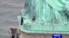 Woman Climbs Statue of Liberty in Standoff With Police