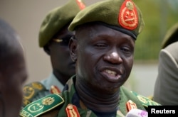 South Sudan's new army chief, General James Ajongo, speaks to reporters after his swearing-in at the Presidential Palace in Juba, South Sudan, May 10, 2017.