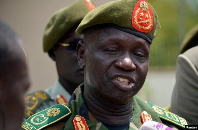 South Sudan's new army chief, General James Ajongo, speaks to reporters after his swearing-in at the Presidential Palace in Juba, South Sudan, May 10, 2017.