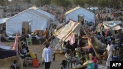 People gather at a makeshift camp at the United Nations Mission in South Sudan (UNMISS) compound in Juba Dec. 22, 2013.