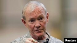 U.S. Chairman of the Joint Chiefs of Staff Army Gen. Martin Dempsey talks to U.S. military personnel stationed at Yokota Air Base in Tokyo, Apr. 25, 2013.