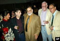 FILE - In this July 18, 2003, file photo, from left, Lainie Kazan, Harry Dean Stanton, Francis Ford Coppola, Frank Pierson and Frederic Forrest reunite during a reception for the screening of the 1982 movie "One from the Heart," at the Academy of Motion Picture Arts and Sciences in Beverly Hills, Calif.