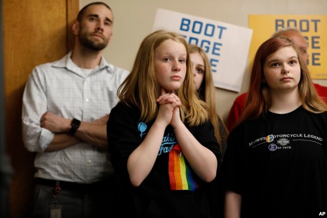 Audience members listen as 2020 Democratic presidential candidate South Bend Mayor Pete Buttigieg speaks during a town hall meeting in Fort Dodge, Iowa, April 16, 2019.