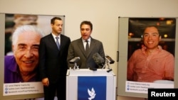FILE - Babak Namazi spoke at a news conference in Vienna in April. His father, Baquer Namazi, pictured left, and his brother Siamak Namazi, right.