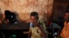 FILE - A Sri Lankan man drinks toddy, the sap of coconut palm, in a improvised neighborhood bar in Colombo, Sri Lanka.