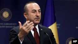 Turkish Foreign Minister Mevlut Cavusoglu speaks to the media during a news conference in Ankara, April 19, 2019.