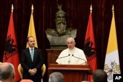 Albania PopePope Francis delivers his speech as Albania's President Bujar Nishani, left, watches in Tirana, Sept. 21, 2014.