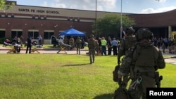 Law enforcement officers respond to Santa Fe High School following a shooting incident in this Harris County Sheriff office, Santa Fe, Texas, photo released on May 18, 2018.