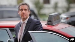 Michael Cohen, President Donald Trump's personal attorney, steps out of a cab during his arrival on Capitol Hill in Washington, Sept. 19, 2017. 