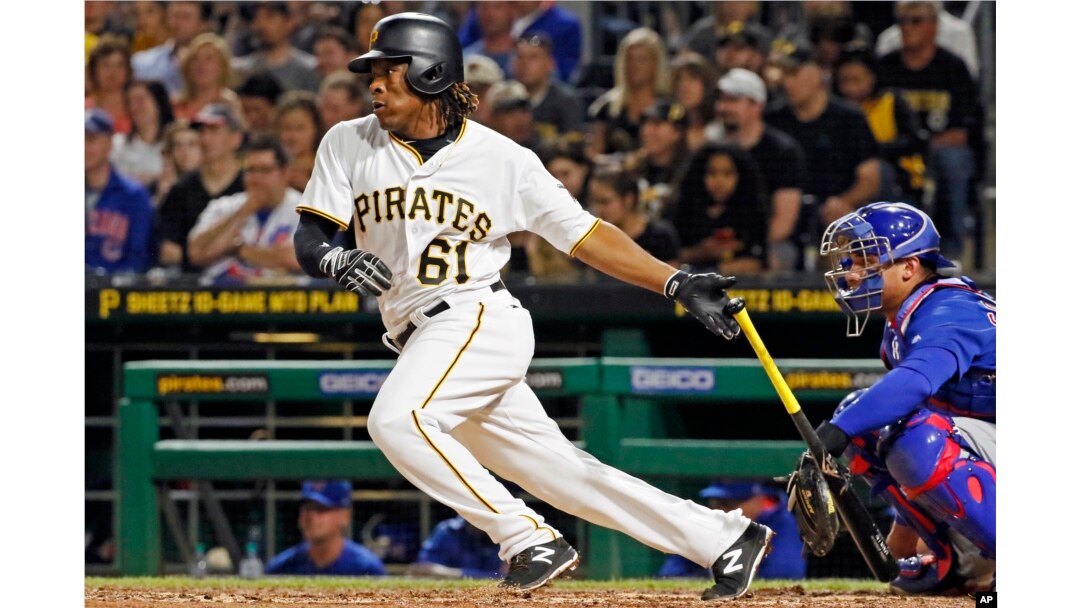 Pittsburgh Pirates' Gift Ngoepe, a native of South Africa, and the first baseball player from the continent of Africa to play in the Major Leagues, hits a single off Chicago Cubs starting pitcher Jon Lester in his first at-bat in the fourth inning of a baseball game in Pittsburgh, April 26, 2017.