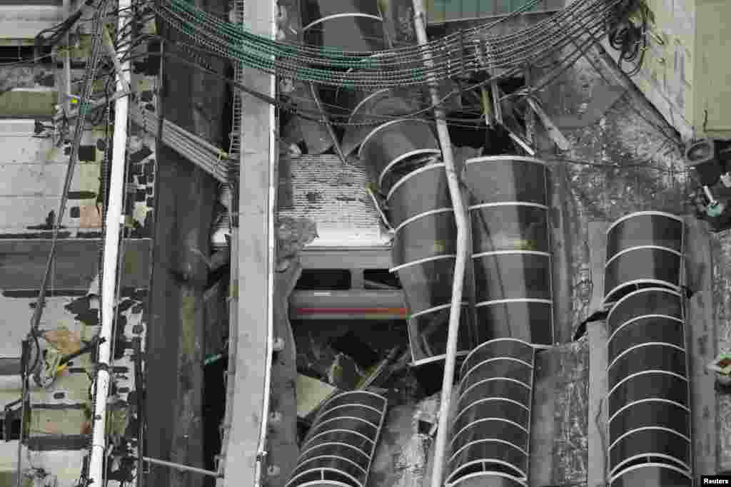 A derailed New Jersey Transit train is seen under a collapsed roof after it crashed into the station in Hoboken, New Jersey. The crash killed at least one person and injured 100 others.&nbsp;
