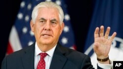 FILE - Secretary of State Rex Tillerson gestures while speaking to State Department employees.