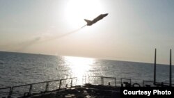 Image of Russian fly-over near guided-missile destroyer USS Donald Cook in Baltic Sea as provided by the U.S. Navy 6th Fleet.