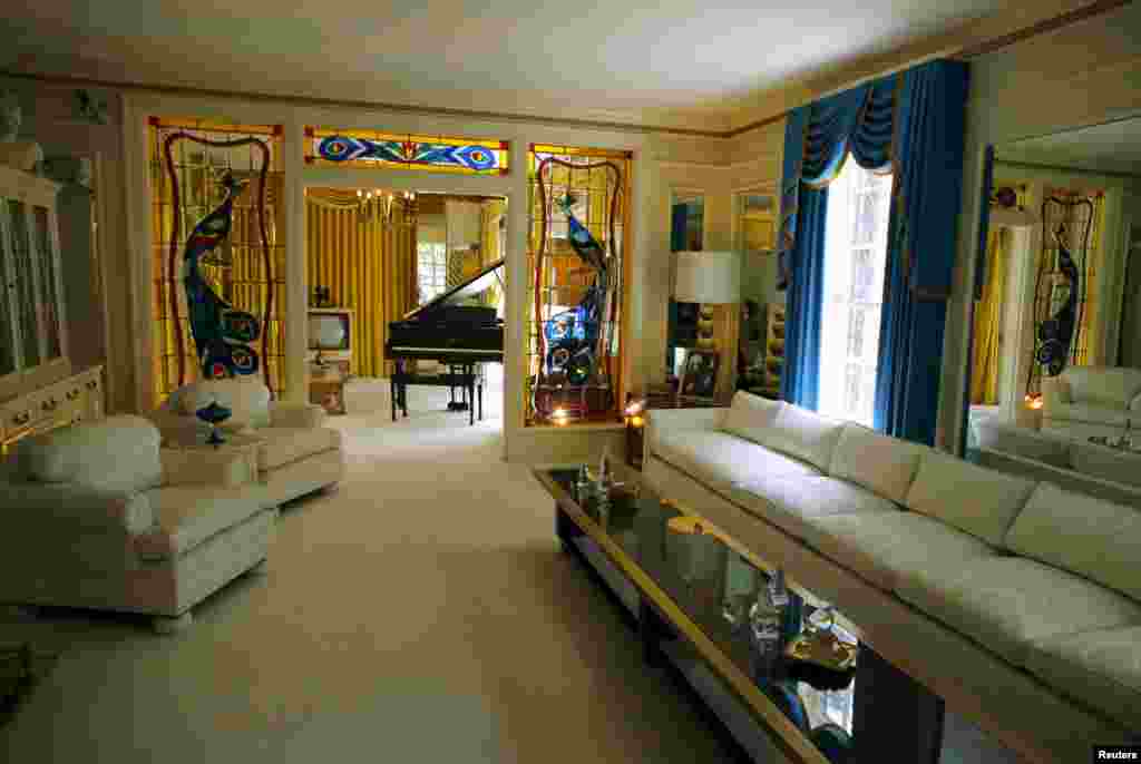 The front room and piano are shown during a tour of Graceland in Memphis, Tennessee, May 28, 2015. The estate that was home to Elvis Presley receives over 600,000 visitors a year and was declared a National Historic Monument in 2006.